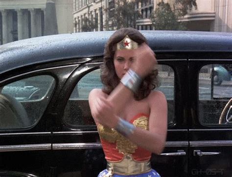 wonder woman cartoon gif|wonder woman deflecting bullets gif.